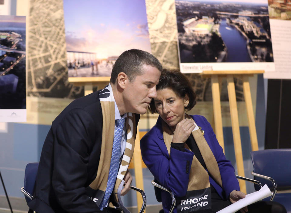 PAWTUCKET, RI - DECEMBER 2: Fortuitous Partners investor Brett M. Johnson chats with Rhode Island Governor Gina M. Raimondo as Pawtucket Mayor Donald Grebien speaks during a press conference to announce the city's largest economic development project in Pawtucket, RI on Dec. 2, 2019. Fortuitous Partners will build the $400 million Tidewater Landing. It will include a new United Soccer League (USL) Championship soccer team and stadium. (Photo by Pat Greenhouse/The Boston Globe via Getty Images)