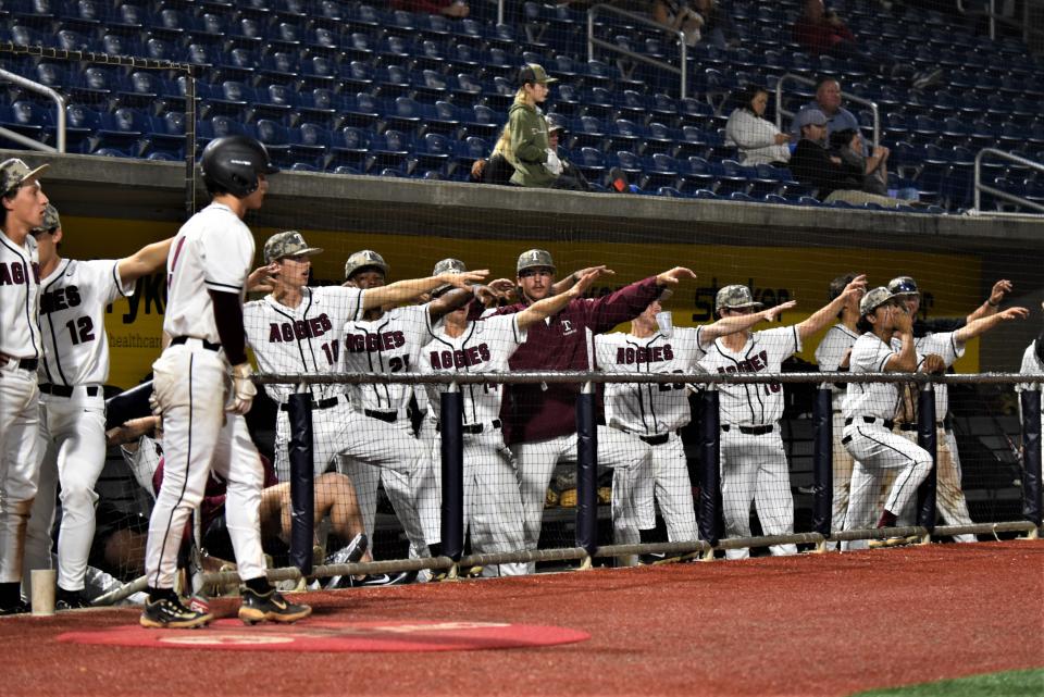 Players from the Tate baseball team remain engaged from the bench during the Aggies' 8-3 victory over South Walton on Thursday, March 23, 2023 from Blue Wahoos Stadium.