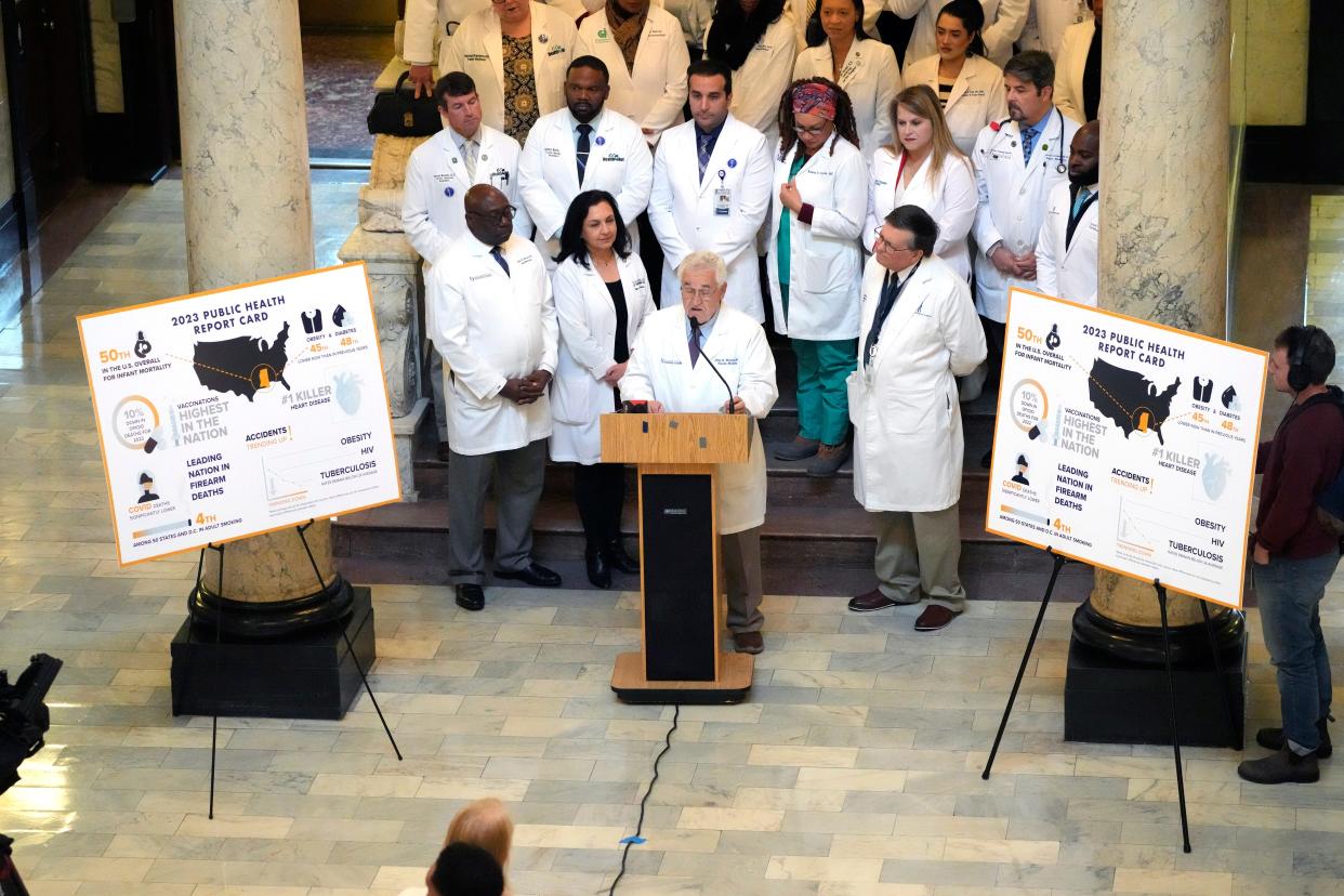 At a news conference inside the Mississippi Capitol, Dr. John Mitchell, center, president of the Mississippi State Medical Association, and flanked by area physicians, called for state leaders to work with health officials to improve Mississippi's status as the nation's unhealthiest state across several metrics, Thursday, Jan. 18, 2024, in Jackson, Miss.