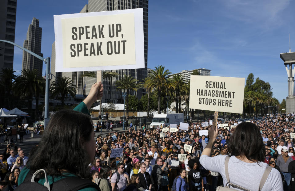 FILE - In this Nov. 1, 2018, file photo, Google employees hold up signs during a walkout rally at Harry Bridges Plaza in San Francisco to protest against what they said is the tech company's mishandling of sexual misconduct allegations against executives. Employees at Google, Amazon, Microsoft and elsewhere are increasingly speaking out about military warfare, immigration and the environment, and questioning the effects of their work. Experts say it’s an unprecedented trend of activism in Big Tech. (AP Photo/Eric Risberg, File)