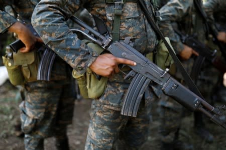 Soldiers stand in formation during a temporary state of siege, approved by the Guatemalan Congress following the death of several soldiers last week, in the community of Semuy II, Izabal province