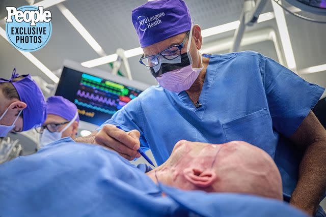 <p>Joe Carotta/NYU Langone Health</p> Dr. Eduardo Rodriguez and the NYU Langone Health team performing face and eye transplant surgery on Aaron James in May 2023.