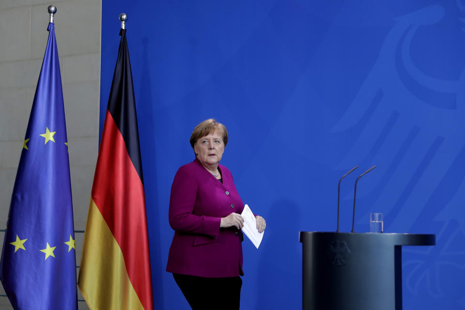 German Chancellor Angela Merkel arrives for media briefing about measures of the German government to avoid further spread of the coronavirus at the chancellery in Berlin, Germany, Thursday, April 9, 2020. In order to slow down the spread of the coronavirus, the German government has considerably restricted public life and asked the citizens to stay at home. The new coronavirus causes mild or moderate symptoms for most people, but for some, especially older adults and people with existing health problems, it can cause more severe illness or death. (AP Photo/Markus Schreiber, Pool)