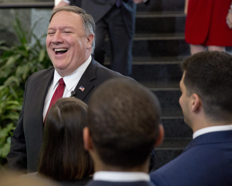 Secretary of State Mike Pompeo smiles while meeting employees after announcing a new 'ethos' statement in the lobby staircase of the U.S. State Department headquarters in Washington, Friday, April 25, 2019. (AP Photo/Pablo Martinez Monsivais)