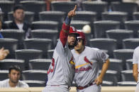 St. Louis Cardinals' Edmundo Sosa (63) gestures to Andrew Knizner at first base after scoring on a two-run single by Knizner during the 11th inning of the team's baseball game against the New York Mets on Tuesday, Sept. 14, 2021, in New York. (AP Photo/Frank Franklin II)