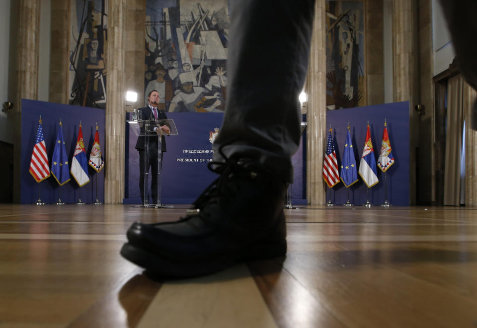 U.S. President Donald Trump's envoy for the Kosovo-Serbia dialogue, Ambassador Richard Grenell, left, listens to Serbian President Aleksandar Vucic during a press conference after a meeting in Belgrade, Serbia, Friday, Jan. 24, 2020. Grenell is meeting Serbian President Vucic in order to move the dialogue and normalize relations between the two sides.(AP Photo/Darko Vojinovic)