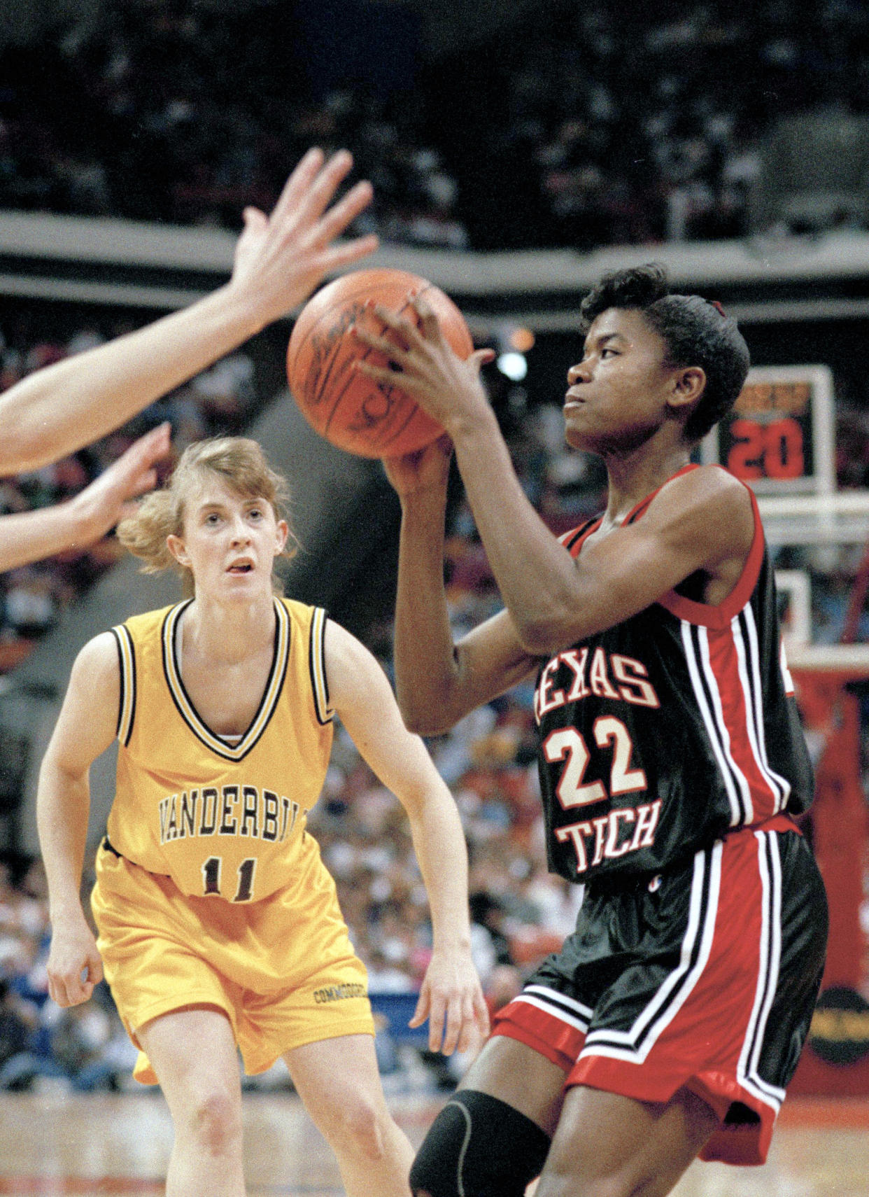 Texas Tech's Sheryl Swoopes goes for the shot after bypassing Vanderbilt's Rhonda Blades during first half action in the semi-final of the NCAA Women's Final Four at Atlanta's Omni, April 3, 1993. Swoopes scored 31 to lead Texas Tech to a 60-46 victory. (AP Photo/Amy Sancetta)