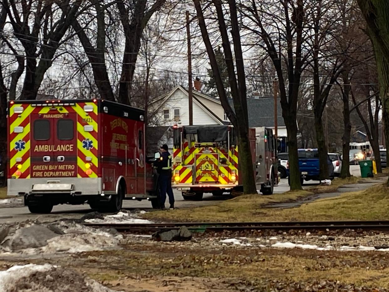 Green Bay police and rescue personnel stage near the 1300 block of Smith Street, where there is a large police presence on Wednesday morning.