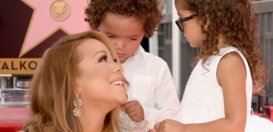 Mariah Carey smiles up at her twins Moroccan and Monroe.