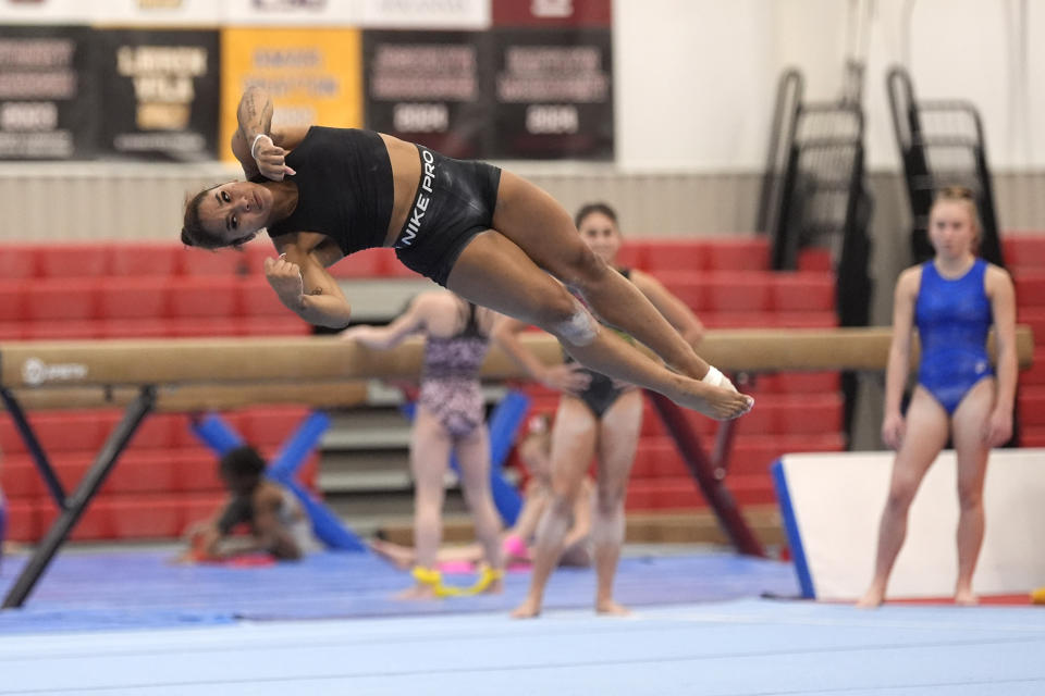 Gymnast Jordan Chiles practices her floor routine Thursday, Feb. 29, 2024, in Spring, Texas. Chiles doesn't have to put herself through this. She knows this. The proof is tattooed on her arm. It's sitting in her trophy room. It's on her social media pages, which are dotted with the kind of partnerships she once never dreamed possible. (AP Photo/David J. Phillip)