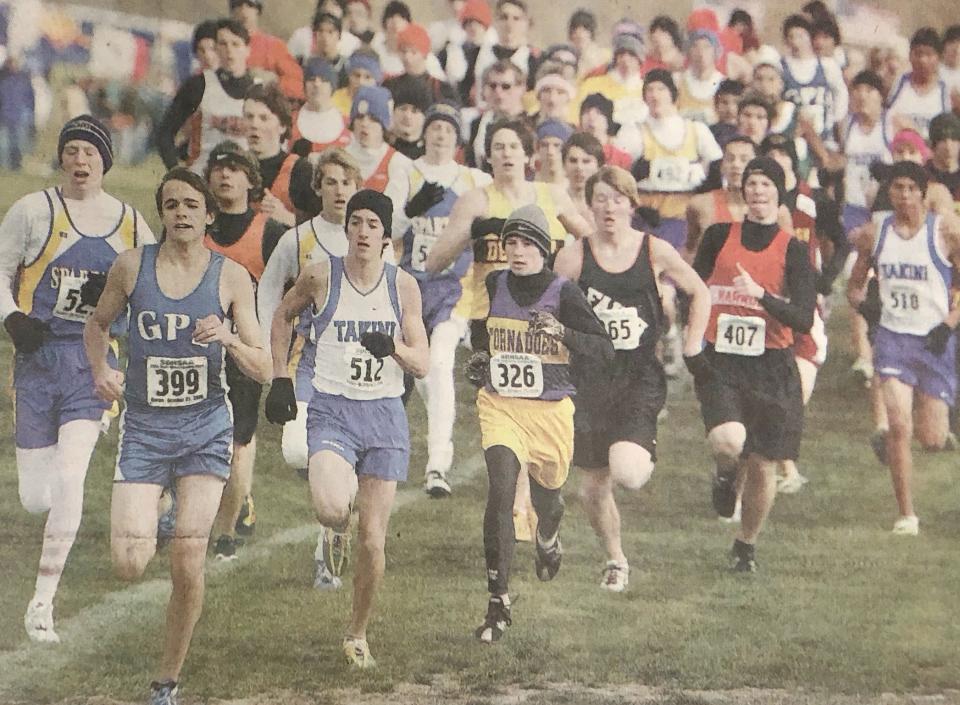John Rawerts of Great Plains Lutheran finished second and Lance Cundy of De Smet (yellow jersey in the middle) third in the Class B boys' race during the 2006 state cross country meet at Huron.