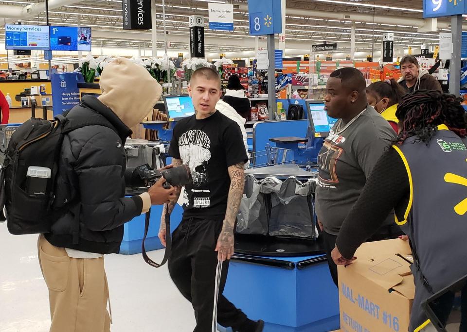 Hip-hop artist Morray and barber Vic Blends appeared at Walmart on Hope Mills on Tuesday afternoon, Dec. 21, 2021. They were buying toys and other gifts to give out at the Christmas Giveback, which is scheduled for Thursday in downtown Fayetteville.