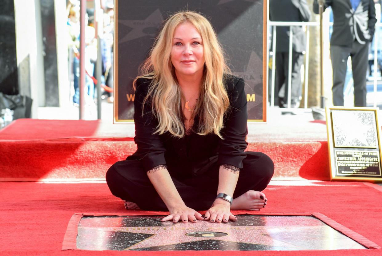 US actress Christina Applegate poses for photos with her newly unveiled Hollywood Walk of Fame star in Hollywood, California, on November 14, 2022. (Photo by VALERIE MACON / AFP) (Photo by VALERIE MACON/AFP via Getty Images)