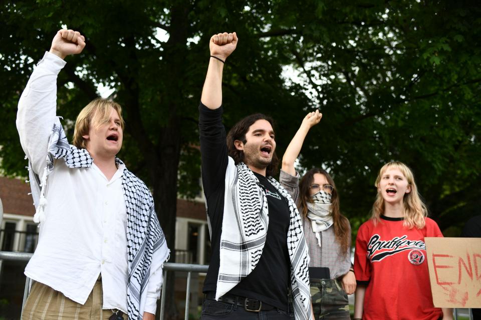 Hasan Atatrah, center, and other pro-Palestine demonstrators who were arrested while gathering on the University of Tennessee at Knoxville campus last week, chant support for Palestine during their news conference May 6. UT is now reserving the Student Union lawn for demonstrators between 7 a.m. and 10 p.m. until at least May 11 but has warned demonstrators it will enforce the state's camping law that prevents people from occupying public property from 10 p.m. to 7 a.m. and includes felony charges for those who break the law.