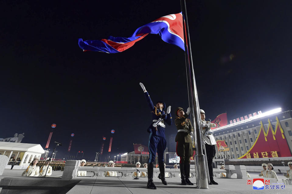 In this photo provided by the North Korean government a North Korean flag is hoisted in the celebration for the ruling party congress, at Kim Il Sung Square in Pyongyang, North Korea Thursday, Jan. 14, 2021. Independent journalists were not given access to cover the event depicted in this image distributed by the North Korean government. The content of this image is as provided and cannot be independently verified. Korean language watermark on image as provided by source reads: "KCNA" which is the abbreviation for Korean Central News Agency. (Korean Central News Agency/Korea News Service via AP)