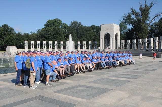Springfield-area veterans gather for a group photo at the World War II Memorial during the Honor Flight of the Ozarks trip to Washington, D.C. on Aug. 23, 2022.