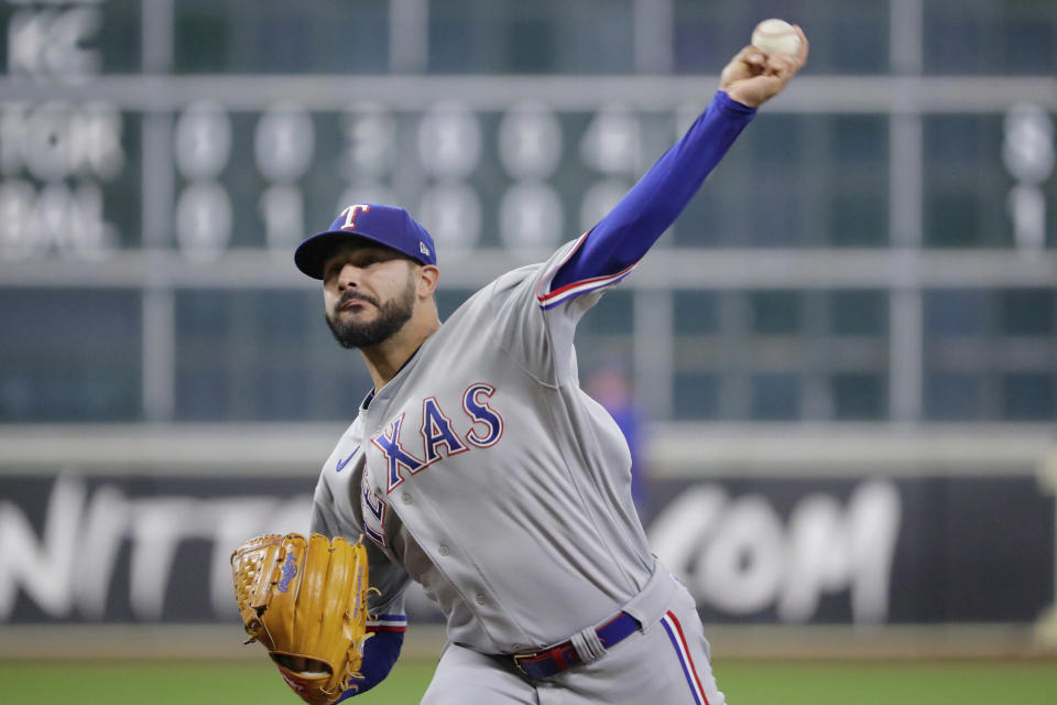 Texas Rangers starting pitcher Martin Perez throws against the Houston Astros during the first inning of a baseball game Monday, Sept. 5, 2022, in Houston. (AP Photo/Michael Wyke)