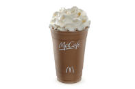 <div class="caption-credit"> Photo by: Credit: McDonald's</div><br> <b>Worst Drink at McDonalds: McCafé Caramel Hot Chocolate (or the McCafé Egg Nog Shake)</b> <br> Yeah, did you really think there was a way to make the Egg Nog Shake healthy? We wish we had magical powers to zap the fat out of your favorite McD's treat, but no can do: vanilla reduced-fat ice cream, egg nog syrup, whipped cream, and a maraschino cherry make that nearly impossible. A medium-sized shake is 680 calories: to put that in perspective, a Quarter Pounder with Cheese is 750 calories - so add on a Kid's Fries to that shake and you're about equal to that burger. A small with no whipped cream or cherry is 460 calories, so the equivalent of the Premium Grilled Club Sandwich at McD's. Of course, a shake isn't really a holiday coffee beverage, but we looked at the holiday coffees, too. The McCafé Caramel Hot Chocolate will still do a number on your waistline: 350 calories for a medium, whole-milk beverage. It's the toppings that really do you in: whipped cream, caramel drizzle, and chocolate caramel syrup. <br>