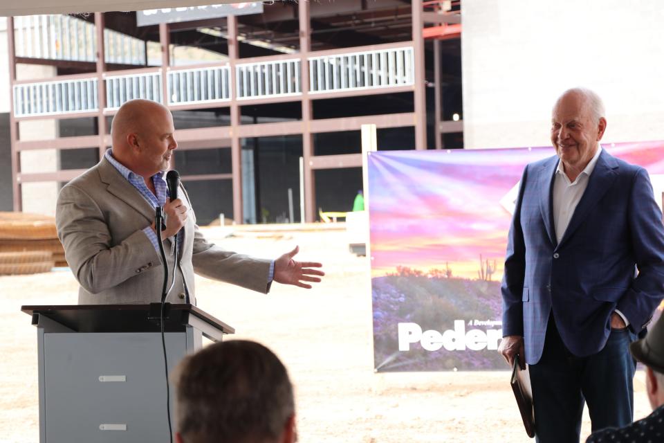 (From left) Peoria Mayor Jason Beck praises Jim Pederson, founder of retail development company The Pederson Group, during a groundbreaking ceremony Wednesday morning, March 6, for a 903,000-square-foot mixed-use development at 83rd Avenue and Happy Valley Road.