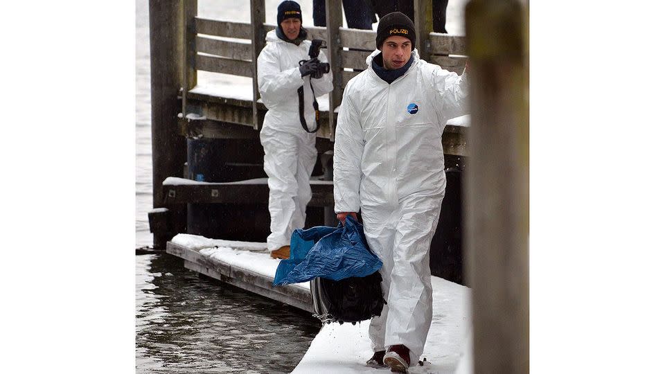 Austrian police carry a bag that was retrieved by police divers from the Traunsee in Gmunden, Austria on 04 January 2016. EPA/THOMAS LEITNER/AAP