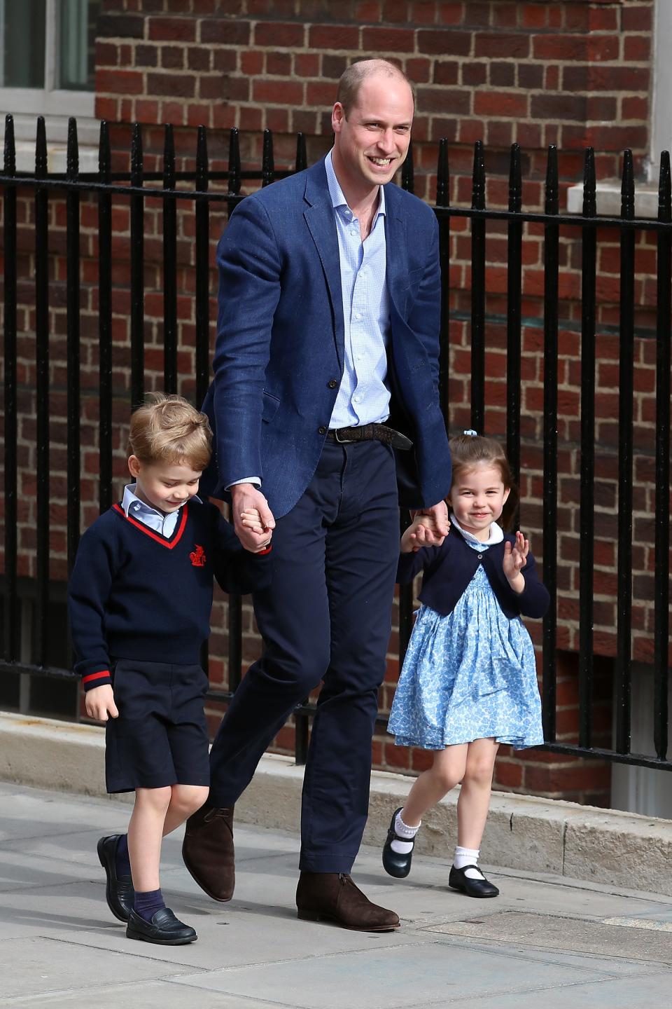 Prince William arrives at St. Mary's Hospital with Prince George and Princess Charlotte to see the new baby. (Photo: Neil Mockford via Getty Images)