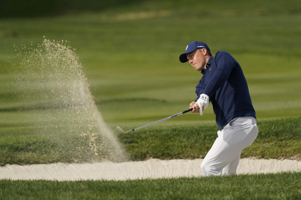 Jordan Spieth follows his shot out of a bunker up to the fourth green of the Pebble Beach Golf Links during the third round of the AT&T Pebble Beach Pro-Am golf tournament in Pebble Beach, Calif., Saturday, Feb. 5, 2022. (AP Photo/Eric Risberg)