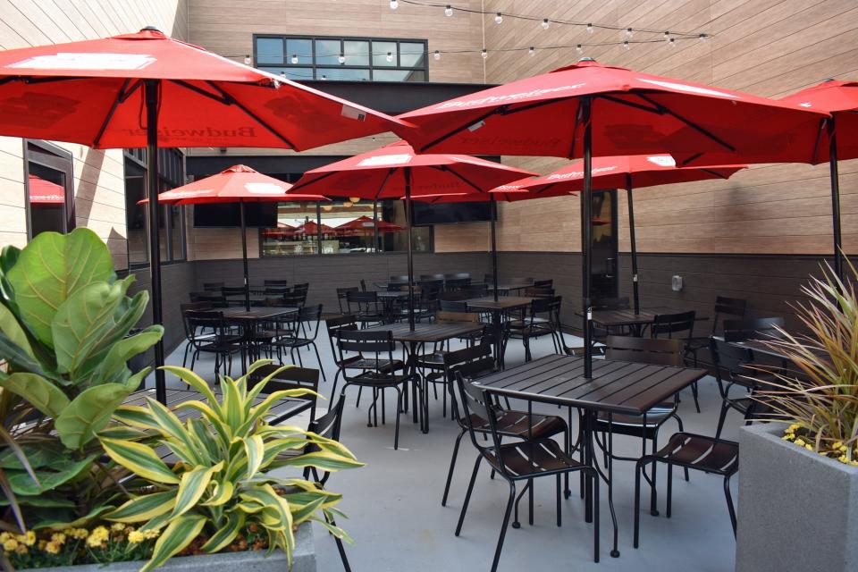 A patio is an oasis between the two sides of Sweet Caroline's, which features a restaurant and bar on the east side and a private banquet venue on the west.