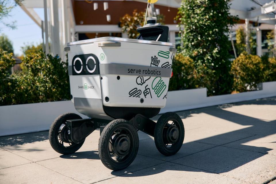 A Serve Robotics robot delivering Shake Shack food.