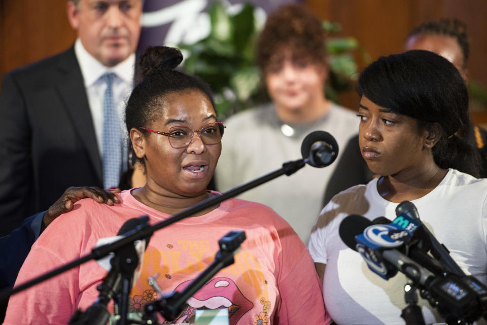 Josephine Wamah, left, with Jasmine Wamah, right, sisters of shooting victim Joseph Wamah Jr., speaks at a news conference with members of the District Attorney's office, elected officials, and community partners at Salt and Light Church in Philadelphia, Wednesday, July 5, 2023. (Allie Ippolito/The Philadelphia Inquirer via AP)