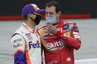 Denny Hamlin, left, and Kyle Busch talk before the NASCAR Cup Series auto race Saturday, Sept. 19, 2020, in Bristol, Tenn. (AP Photo/Steve Helber)