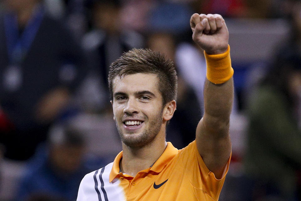 Borna Coric of Croatia celebrates after winning his men's singles semifinals match against Roger Federer of Switzerland in the Shanghai Masters tennis tournament at Qizhong Forest Sports City Tennis Center in Shanghai, China, Saturday, Oct. 13, 2018 (AP Photo/Andy Wong)