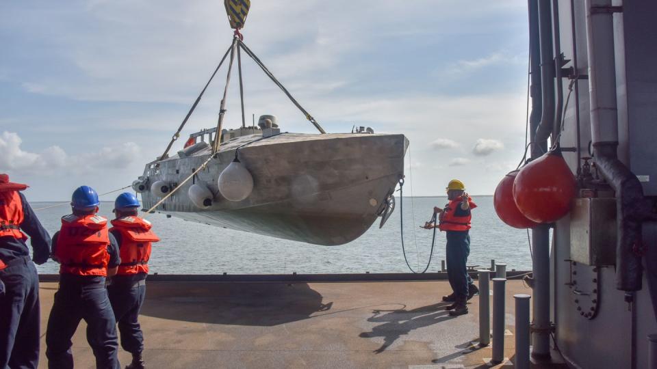 U.S. Navy personnel demonstrate the mine countermeasure mission package aboard an expeditionary sea base vessel in 2019. The demo showed the package could be used aboard vessels in addition to littoral combat ships. (Anthony Powers/U.S. Navy)