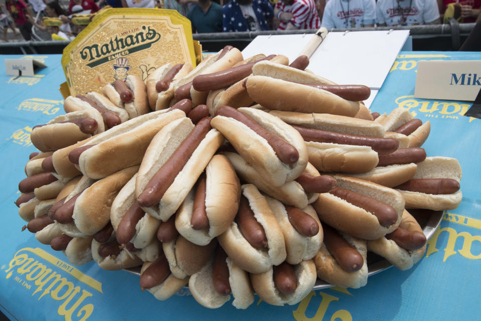 <p>Hot dogs are on display on stage ahead of the Nathan’s Famous Fourth of July hot dog eating contest, Wednesday, July 4, 2018, in New York’s Coney Island. (Photo: Mary Altaffer/AP) </p>