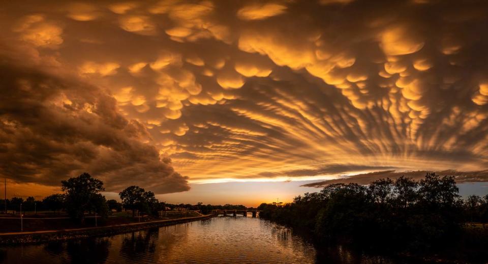 Mammatus clouds form over the Arkansas River after a line of thunderstorms passed through he Wichita area.