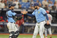 Tampa Bay Rays relief pitcher Colin Poche, right, celebrates with catcher Rene Pinto after closing out the Los Angeles Angels during a baseball game Thursday, April 18, 2024, in St. Petersburg, Fla. The Rays beat the Angels 2-1. (AP Photo/Chris O'Meara)