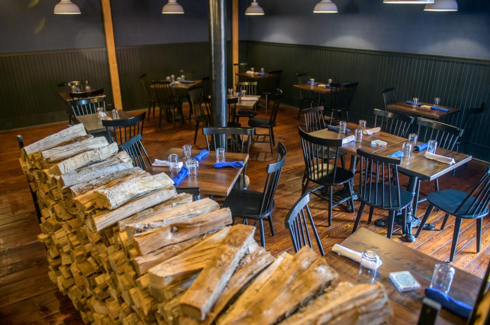 A huge pile of wood for the new kitchen serves as a barrier at the entrance to the new dining room at Ardor Breads and Provisions on Water Street in Peoria.