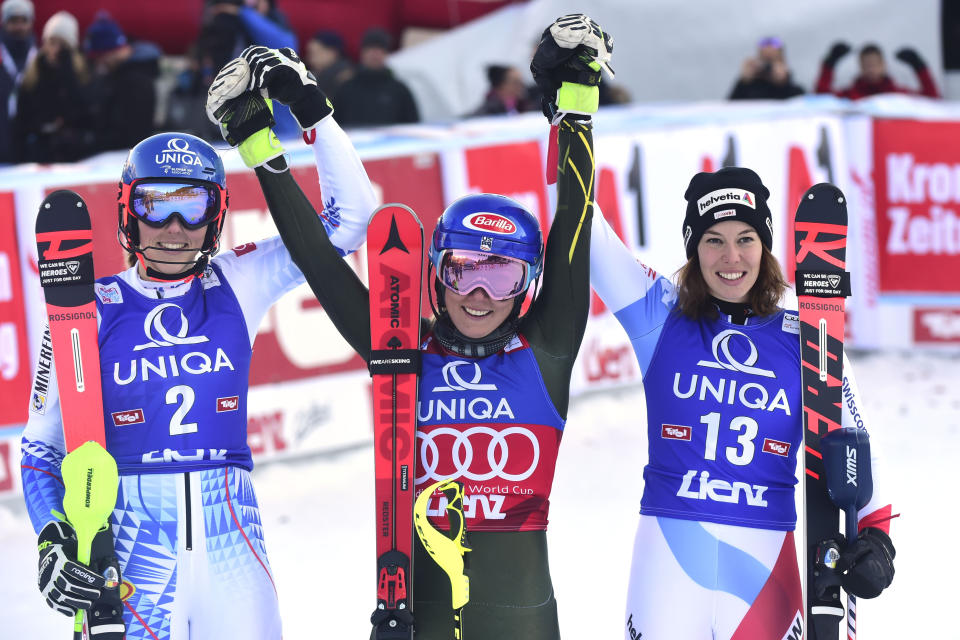 From left, second placed Slovakia's Petra Vlhova, first placed United States' Mikaela Shiffrin and third placed Switzerland's Michelle Gisin celebrate after completing an alpine ski, women's World Cup slalom in Lienz, Austria, Sunday Dec. 29, 2019. (AP Photo/Pier Marco Tacca)