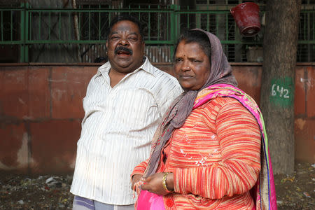 Kanaga Lingam, who claims his son was travelling on the boat which was illegally heading to New Zealand, and Sugana, mother of Prabhu Dhandapani who was detained by police on the suspicion of sending people on the same boat, speak at a park in a residential area in New Delhi, India, January 23, 2019. Picture taken January 23, 2019. REUTERS/Anushree Fadnavis