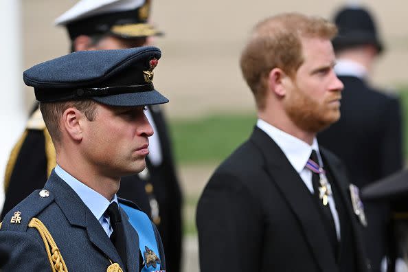 LONDON, ENGLAND - SEPTEMBER 19: Prince William, Prince of Wales and Prince Harry, Duke of Sussex follow behind The Queen's funeral cortege borne on the State Gun Carriage of the Royal Navy as it leaves Westminster Abbey on September 19, 2022 in London, England. Elizabeth Alexandra Mary Windsor was born in Bruton Street, Mayfair, London on 21 April 1926. She married Prince Philip in 1947 and ascended the throne of the United Kingdom and Commonwealth on 6 February 1952 after the death of her Father, King George VI. Queen Elizabeth II died at Balmoral Castle in Scotland on September 8, 2022, and is succeeded by her eldest son, King Charles III.  (Photo by Jeff Spicer/Getty Images)