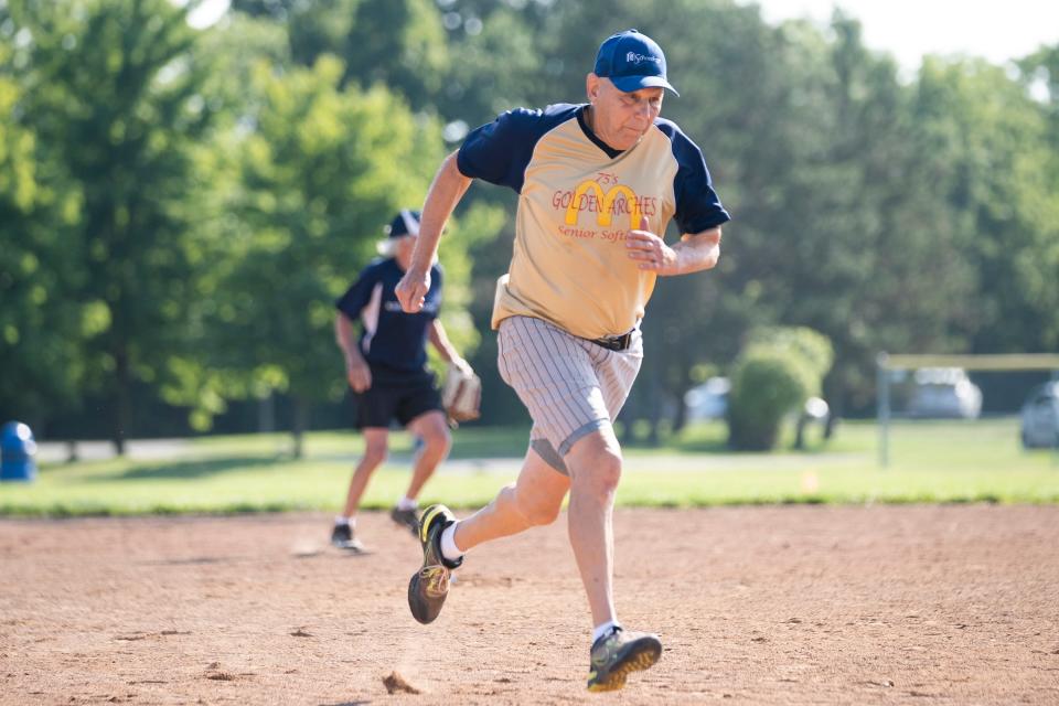 Jul 11, 2023; Hilliard, Ohio, USA;  Ron Miller runs into home during the Tuesday match of the Central Ohio Senior Softball Association at the Roger A. Reynolds Municipal Park. 
