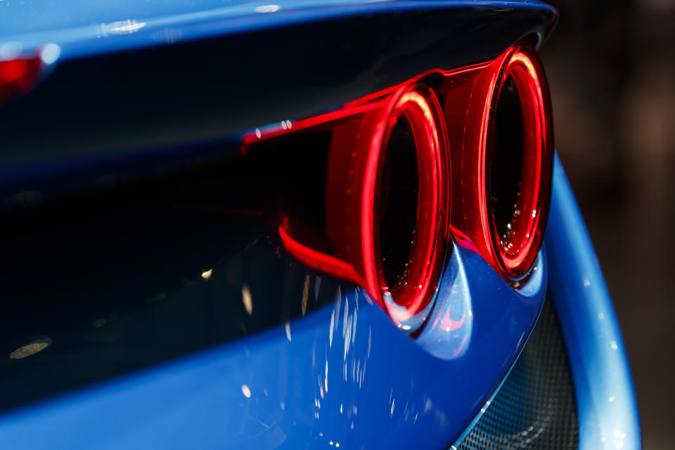 CAPTION CORRECTS CAR NAME - A rear light of the new 'Ferrari F8 Tributo' is pictured during the press day at the '89th Geneva International Motor Show' in Geneva, Switzerland, Tuesday, March 05, 2019. The 'Geneva International Motor Show' takes place in Switzerland from March 7 until March 17, 2019. Automakers are rolling out new electric and hybrid models at the show as they get ready to meet tougher emissions requirements in Europe - while not forgetting the profitable and popular SUVs and SUV-like crossovers. (Cyril Zingaro/Keystone via AP)