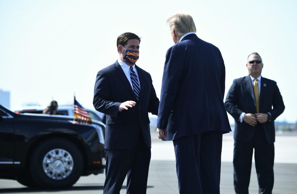 Donald Trump with Doug Ducey, left