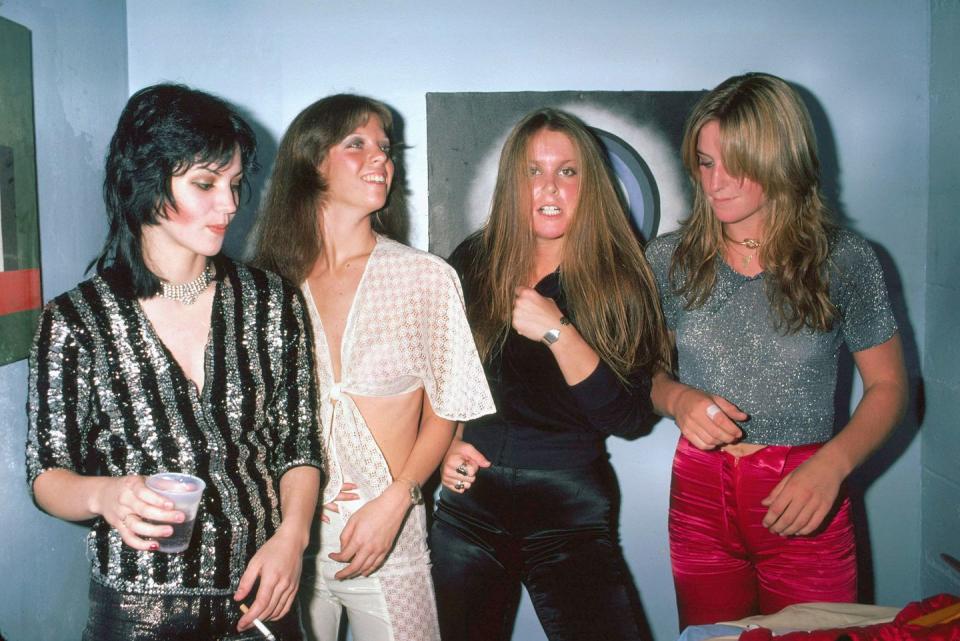 <p>The Runaways (L-R Joan Jett, Jackie Fox, Lita Ford, Sandy West) backstage at CBGB's in New York on August 2, 1976.</p>