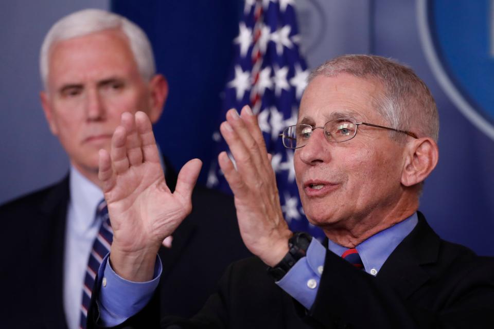 Dr. Anthony Fauci, director of the National Institute of Allergy and Infectious Diseases, speaks about the coronavirus in the James Brady Briefing Room, Wednesday, March 25, 2020, in Washington, as Vice President Mike Pence listens. (AP Photo/Alex Brandon)