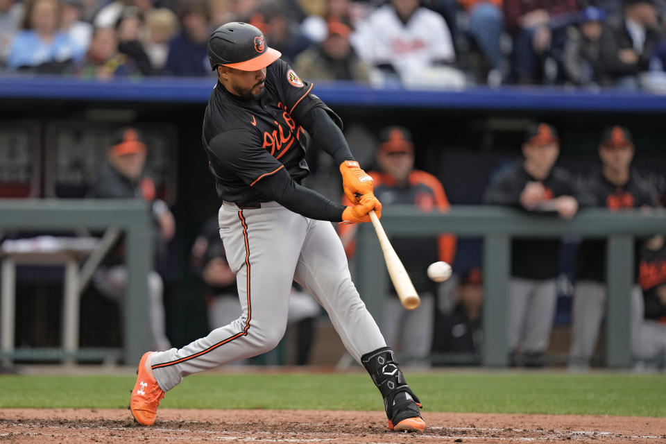 Baltimore Orioles' Anthony Santander hits an RBI double during the second inning of a baseball game against the Kansas City Royals Saturday, April 20, 2024, in Kansas City, Mo. (AP Photo/Charlie Riedel)
