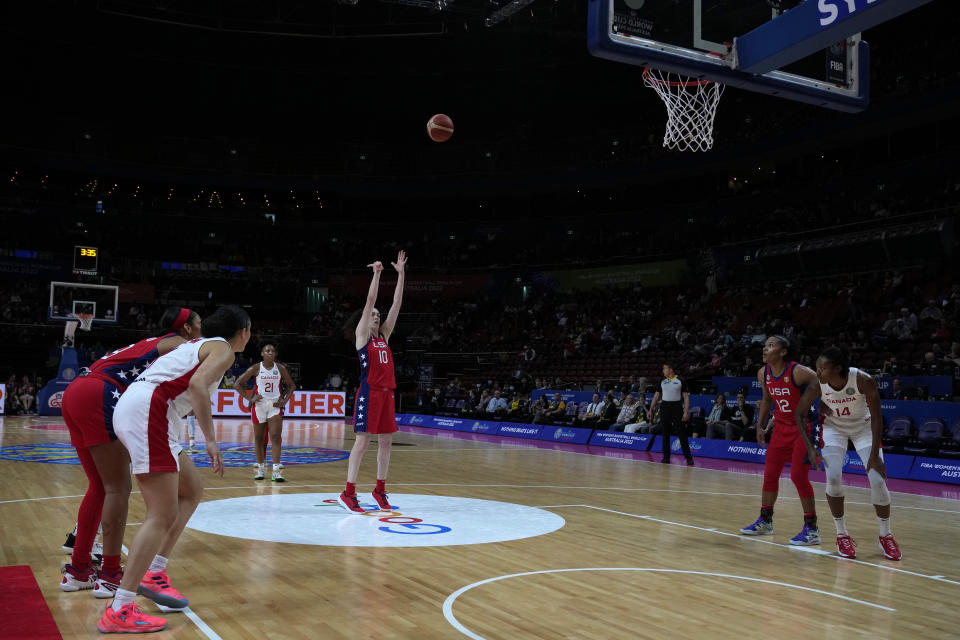 United States' Breanna Stewart, center, shoots a free throw against Canada during their semifinal game at the women's Basketball World Cup in Sydney, Australia, Friday, Sept. 30, 2022. (AP Photo/Rick Rycroft)