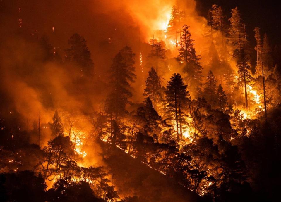 The Dixie Fire burns near Highway 70 on July 21, 2021, in the Feather River canyon in Plumas County. The blaze is the largest-single source wildfire in California history.