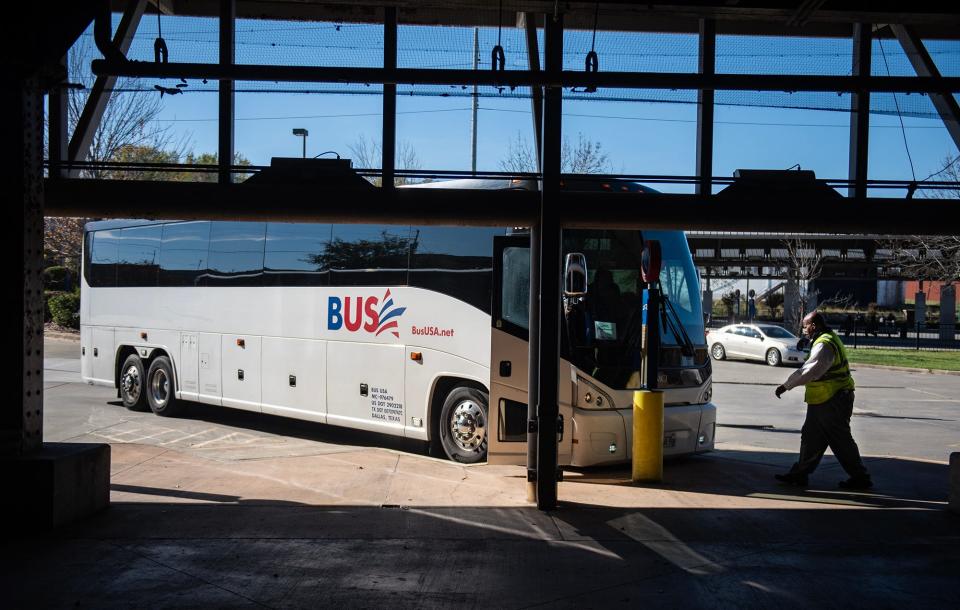 Darren Lewis, 57, a bus driver, walks over to drive a Greyhound bus headed to Dallas, from Union Station in Jackson, on Wednesday. Greyhound Lines Inc., the largest provider of intercity bus transportation in North America, resumed service in Jackson on Wednesday.