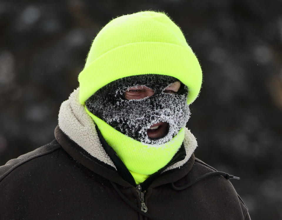 A pedestrian walks in the cold in Carleton Place, Ontario on Monday, Jan. 21, 2019. (Sean Kilpatrick/The Canadian Press via AP)