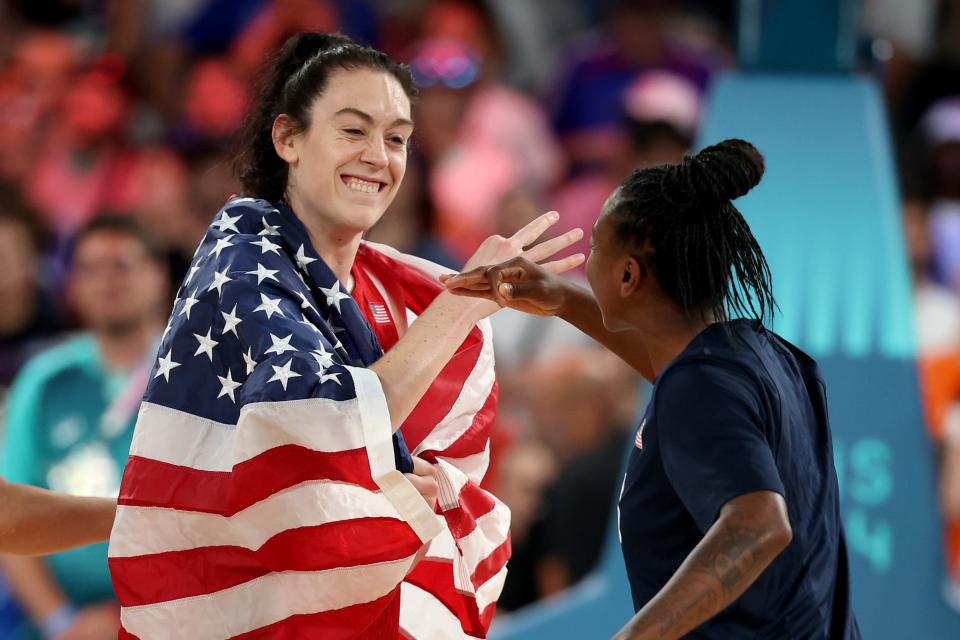 PARIS, FRANCE - AUGUST 11: Breanna Stewart #10 and Jewell Loyd #4 of Team United States celebrate after their team's victory against Team France during the Women's Gold Medal game between Team France and Team United States on day sixteen of the Olympic Games Paris 2024 at Bercy Arena on August 11, 2024 in Paris, France. (Photo by Gregory Shamus/Getty Images) ORG XMIT: 776138675 ORIG FILE ID: 2166338526